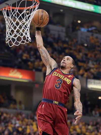 In this April 20, 2018, file photo, Cleveland Cavaliers’ George Hill goes up for a dunk during the first half against the Indiana Pacers in Game 3 of a first-round NBA basketball playoff series in Indianapolis. Cavaliers starting point guard George Hill is questionable for Wednesdays, April 25, crucial Game 5 against Indiana because of back spasms. (Darron Cummings / Associated Press)