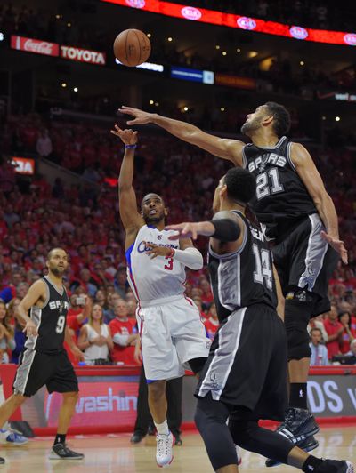 Clippers guard Chris Paul puts up winning shot over Tim Duncan. (Associated Press)