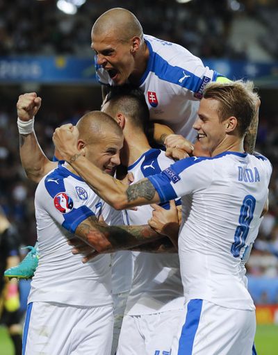 Slovakia's players celebrate after Marek Hamsik scored his goal. (Frank Augstein / Associated Press)