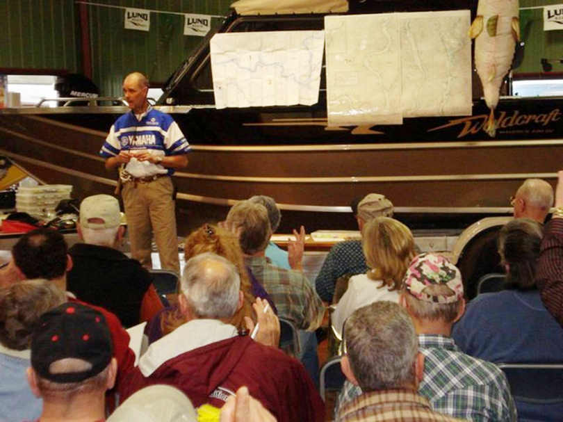 Alan Roberts delivers a seminar on planning a year of fishing at Mark’s Marine in Hayden.  (Courtesy)