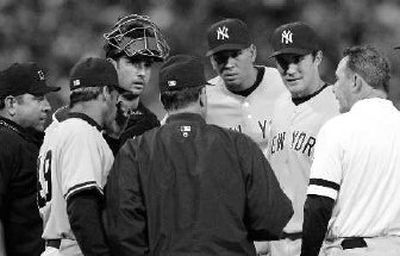 New York pitcher Mike Mussina, second from right, went on the disabled list.
(Associated Press / The Spokesman-Review)