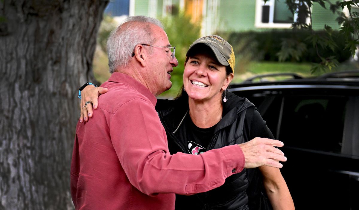 John Luppert hugs Trina Nation in front of his home in Spokane on Sept. 28. He tossed a message and film canister into the ocean off the coast of Hawaii in 1999. Trina found it 18 years later in Alaska.  (Kathy Plonka/The Spokesman-Review)