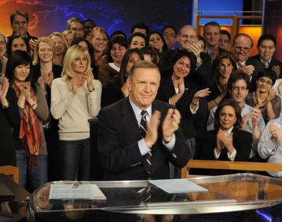 In this photo provided by ABC, anchor Charles Gibson is is surrounded by friends and colleagues at ABC News headquarters in New York, Friday, Dec. 19, 2009, during his final broadcast of 