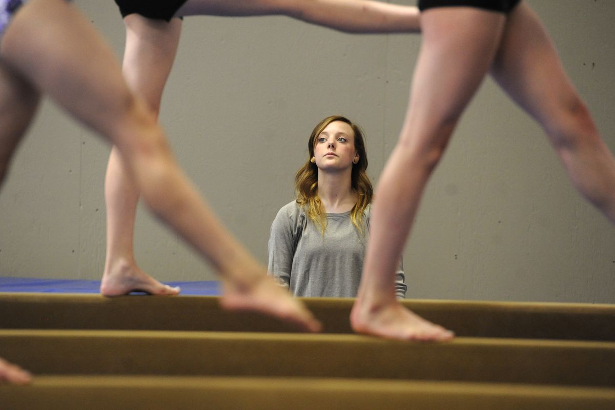 Tiara Racicot, owner of Evergreen Gymnastics, works with athletes at the new gym at 10808 N. Perry Road. (Jesse Tinsley)