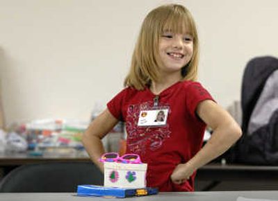 
Charley Jordan, 8, is all smiles Friday, the last day of camp at Spokane Mental Health. She made crafts and had pizza for lunch. 
 (Dan Pelle / The Spokesman-Review)
