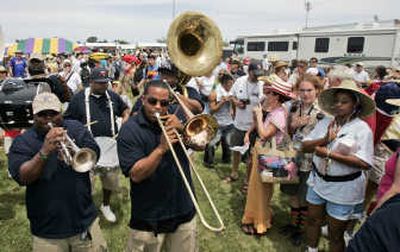 
A traditional jazz band winds its way through the crowd at the New Orleans Jazz and Heritage Festival in New Orleans in April. A trip to see traditional jazz in New Orleans  could be considered 