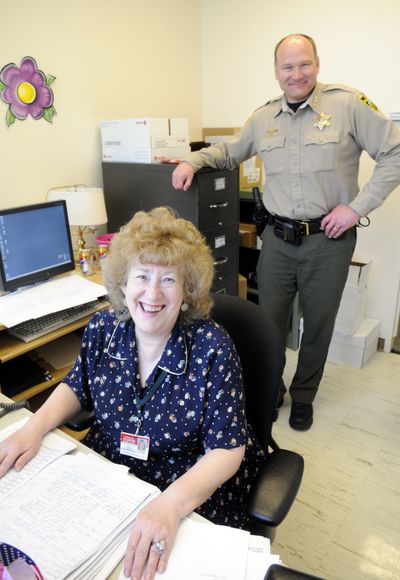 SCOPE volunteer Georgiana Sutherlin  and Sheriff Ozzie Knezovich  are seen at  her Spokane office Tuesday.jesset@spokesman.com (Jesse Tinsley)