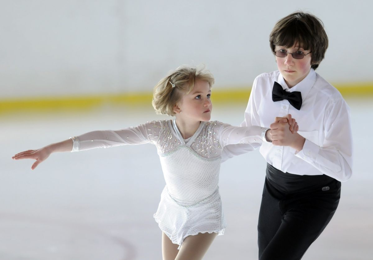 Daria Baer, 8,  watches her brother Ian Baer, 12, as they perform during Skate at the Park on Saturday  at Riverfront Park.  (Photos by Jesse Tinsley / The Spokesman-Review)