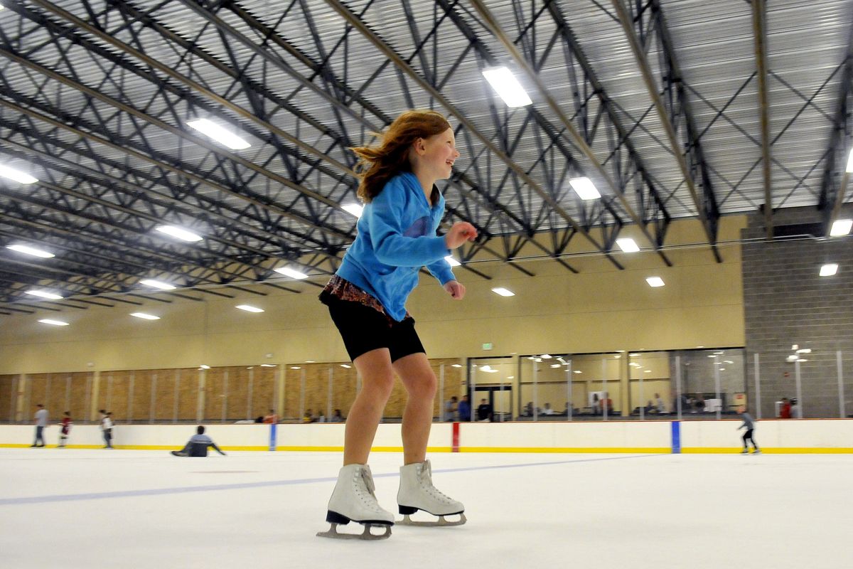 Ashley Miller, 9, tries out the new rink Tuesday at Frontier Ice Arena, just outside of Coeur d’Alene. The old rink, which served dozens of hockey teams for school-age players, collapsed in a snowstorm a few years ago. The new facility opened for its first public skate Tuesday. (Jesse Tinsley)