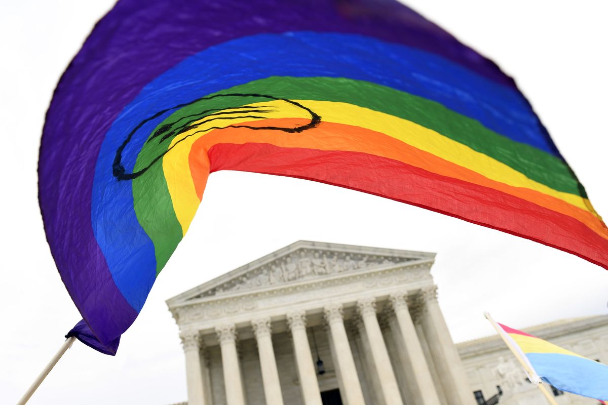 Protesters gather outside the Supreme Court on Oct. 8, 2019, in Washington. Legislation that would create new protections for LGBTQ Americans is stalling out in the U.S. Senate. Democrats were hopeful they could pass the Equality Act this year since they control Congress and the White House.  (Associated Press)