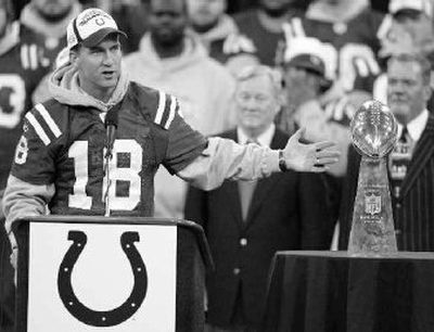 Quarterback Peyton Manning, the Super Bowl MVP, has his moment in the celebration spotlight.
(Associated Press / The Spokesman-Review)