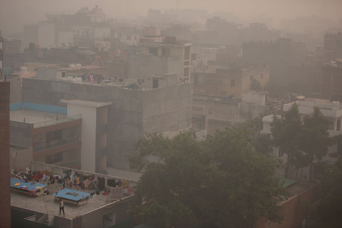 Morning haze and smog envelops the skyline Friday in New Delhi, India. The city’s pollution crisis worsened Sunday as air quality hit dangerous levels.  (Altaf Qadri)