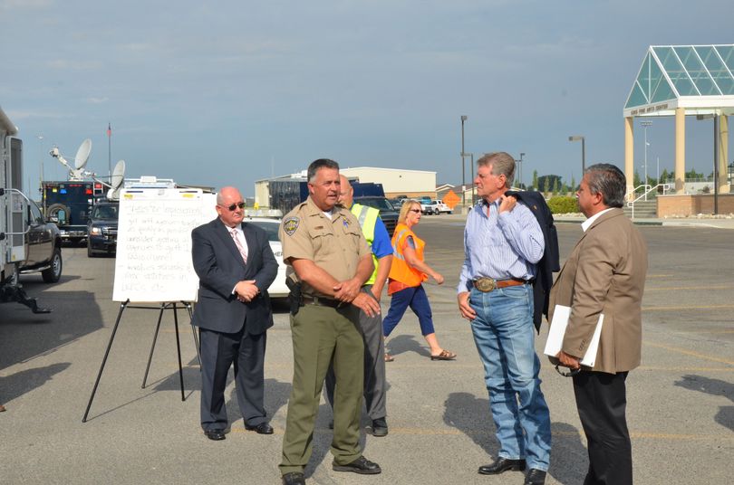 Officials including Gov. Butch Otter and state school Supt. Tom Luna, at right, at a school emergency preparedness drill Wednesday in Burley, Idaho (State of Idaho / Jon Hanian)