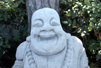 
Eleven happy Buddhas watch over the property.
 (The Spokesman-Review)