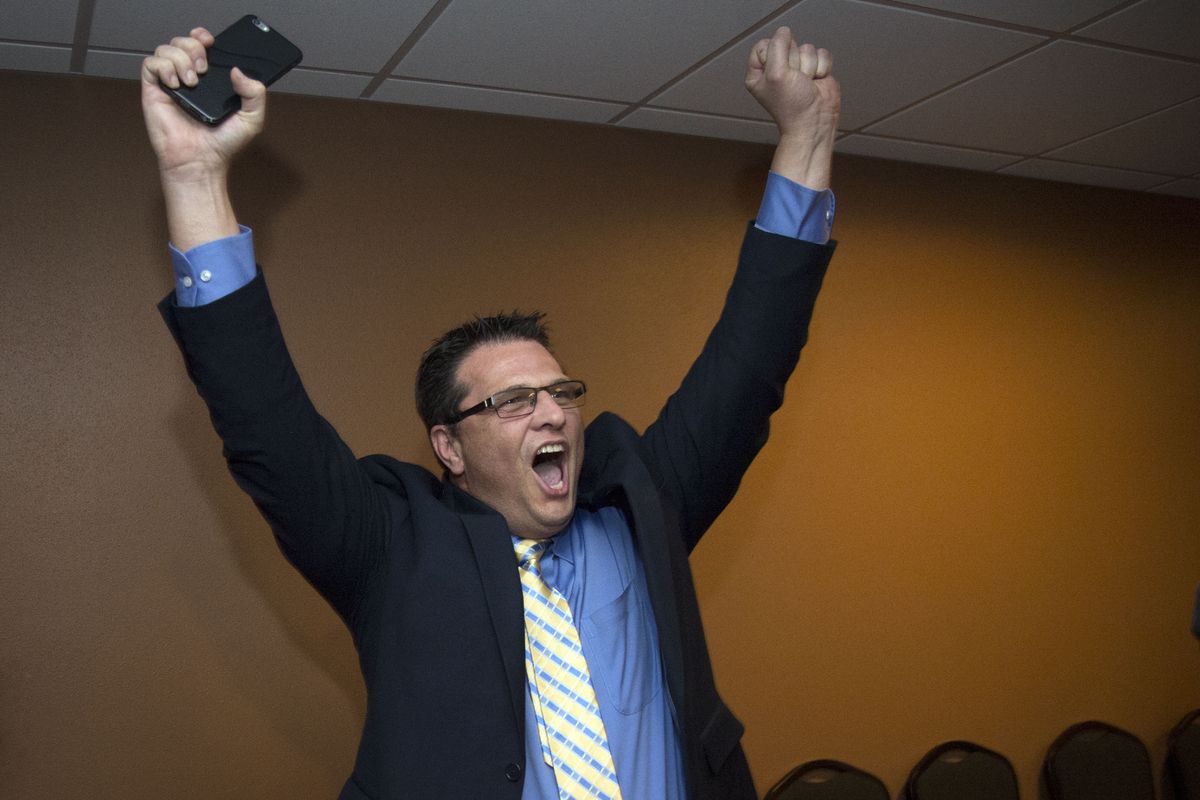 Ben Small, superintendent of Central Valley School District, celebrates with supporters over the apparent passage of a bond and levy. (Colin Mulvany)