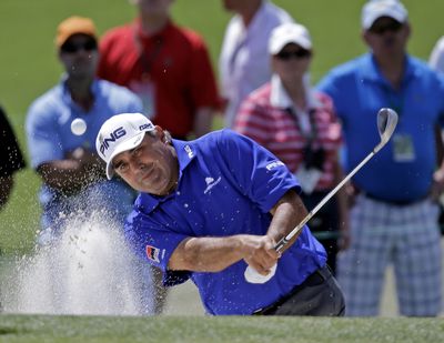 Past Masters champion Angel Cabrera of Argentina hits out of a bunker on Saturday. He’s tied for the lead with Brandt Snedeker. (Associated Press)