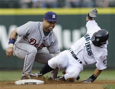 Mariners' Ichiro Suzuki, right, steals second, avoiding a tag by Detroit's Placido Polanco. Associated Press
 (Associated Press / The Spokesman-Review)