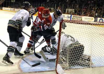 
Spokane Chiefs captain Adam Hobson (10) mixed it up with three Seattle players during Friday's game at the Arena. 
 (Jed Conklin / The Spokesman-Review)