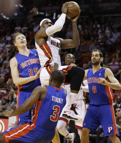 LeBron James splits the Detroit defense for two of his 29 points. (Associated Press)
