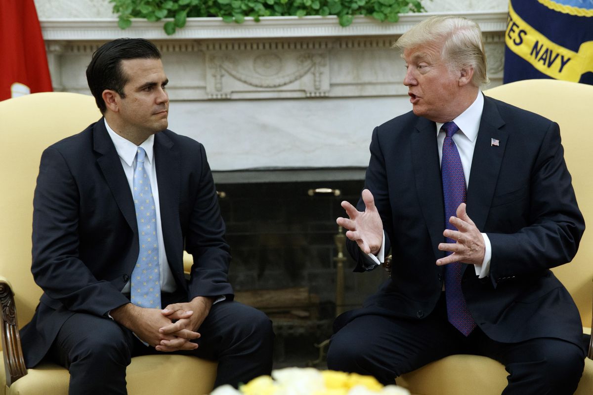 President Donald Trump meets with Governor Ricardo Rossello of Puerto Rico in the Oval Office of the White House, Thursday, Oct. 19, 2017, in Washington. “I think we did a fantastic job,” Trump said, responding to a question from a reporter at the White House on Wednesday, Aug. 29, 2018, a day after a sweeping report raised the death toll from Hurricane Maria to nearly 3,000. (Evan Vucci / Associated Press)