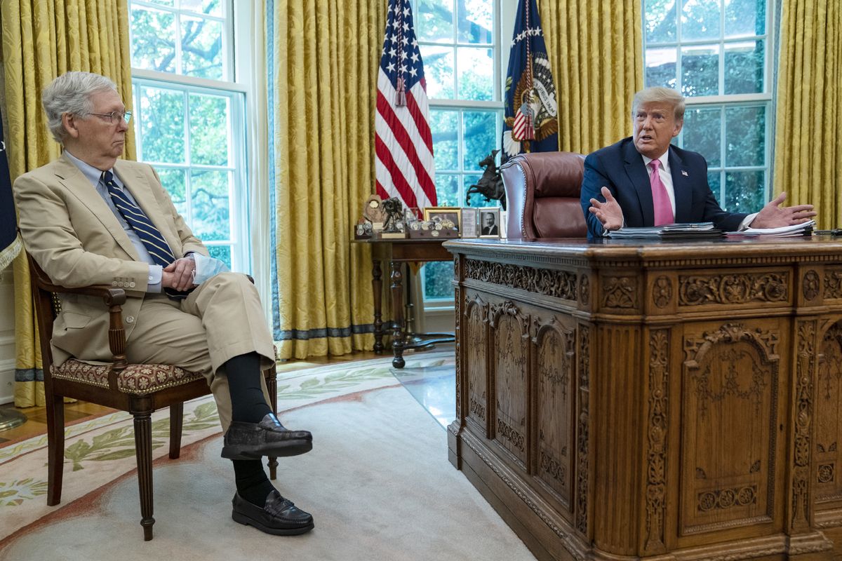 Senate Majority Leader Mitch McConnell of Ky., listens as President Donald Trump speaks during a meeting in the Oval Office of the White House, Monday, July 20, 2020, in Washington.  (Evan Vucci)