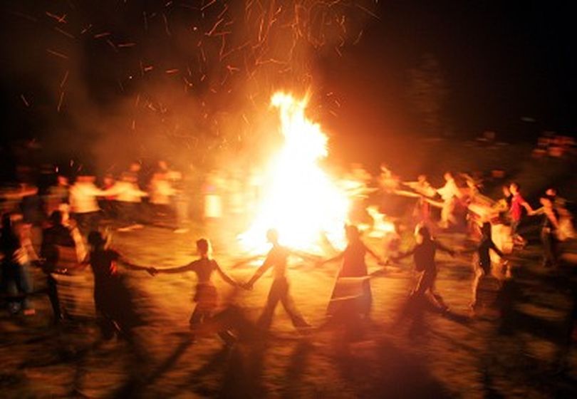 Belarusian neo-pagans dance around a bonfire celebrating the summer solstice in small town Rakov, some 45 kilometers (28 miles) northwest from Minsk, Saturday, June 23, 2007. The festivities of Ivan Kupala, or John the Baptist, is similar to MardiGras and reflects pre-Christian Slavic traditions and practices. (AP Photo/Sergei Grits) ORG XMIT: MIN106 (Sergei Grits / The Spokesman-Review)