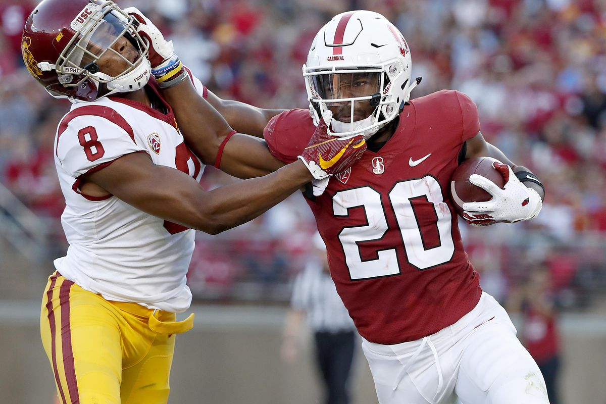 Stanford running back Bryce Love (20) stiff-arms Southern California cornerback Iman Marshall (8) during the first half of an NCAA college football game, Saturday, Sept. 8, 2018, in Stanford, Calif. (Tony Avelar / AP)