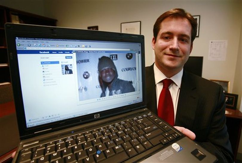 Assistant U.S. Attorney Michael Scoville displays part of the Facebook page, and an enlarged profile photo, of fugitive Maxi Sopo Tuesday, Oct. 13, 2009, in Seattle. Sopo is currently in a Mexico City jail awaiting extradition to the U.S. He was arrested while living as a fugitive in Mexico after he added a former Department of Justice official to his friend list on the social networking website Facebook.com. (AP Photo/Elaine Thompson) (Elaine Thompson / Associated Press)