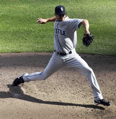 Seattle Mariners relief pitcher Brian Sweeney throws during the sixth inning. (Morry Gash / Associated Press)