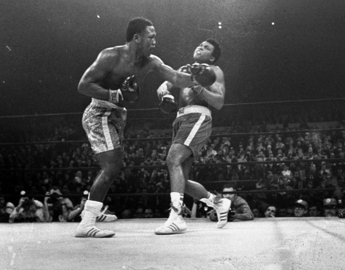 Joe Frazier hits Muhammad Ali with a left during the 15th round of their heavyweight title fight at New York’s Madison Square Garden on March 8, 1971.  (Associated Press)