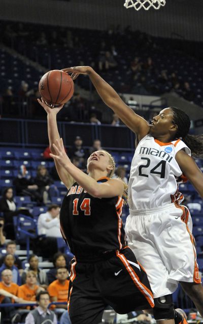 Miami’s Jessica Capers swoops in to block a shot by Idaho State's Chelsea Pickering. (Jesse Tinsley)