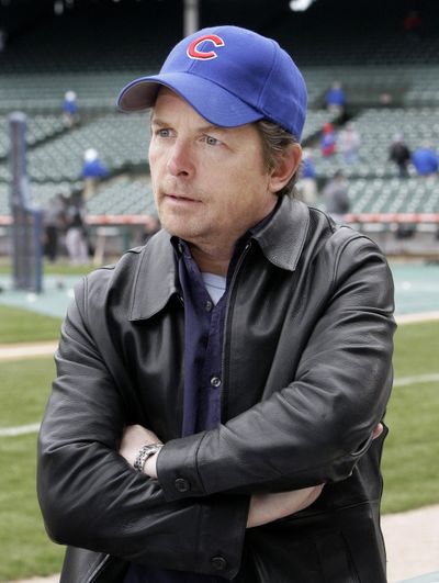 Actor Michael J. Fox is shown  before the start of a baseball game between the Cubs and Colorado Rockies at Wrigley Field in Chicago on April 15.  (Associated Press / The Spokesman-Review)