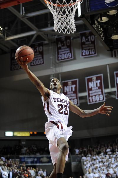Temple's Ramone Moore helps the Owls drive past Georgetown.  (Associated Press)