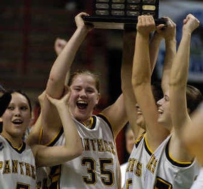 
Cara Shepherd (35) and her Cusick Panthers teammates celebrate a victory over Almira/Coulee-Hartline in the State B girls final. 
 (Christopher Anderson/ / The Spokesman-Review)