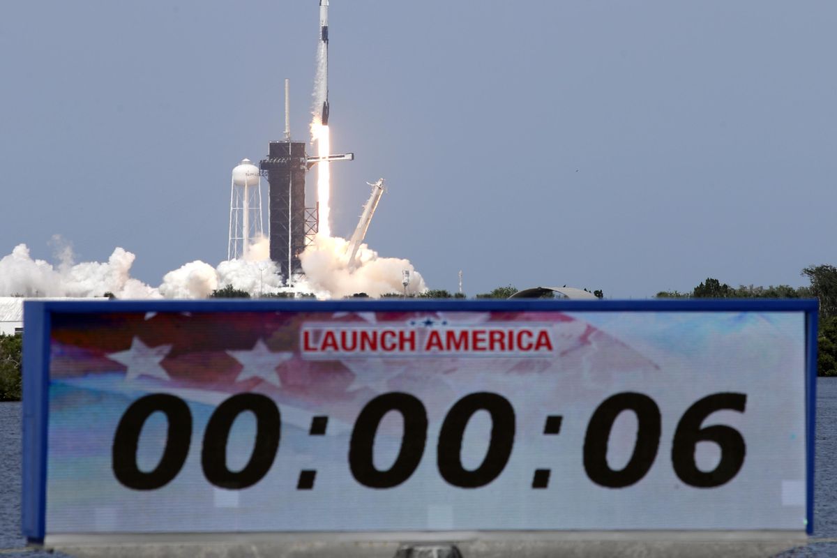 A SpaceX Falcon 9, with NASA astronauts Doug Hurley and Bob Behnken in the Dragon crew capsule, lifts off from Pad 39-A at the Kennedy Space Center in Cape Canaveral, Fla., Saturday, May 30, 2020. For the first time in nearly a decade, astronauts blasted towards orbit aboard an American rocket from American soil, a first for a private company. (John Raoux / AP)