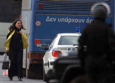 
A  hostage gets off a hijacked bus Wednesday as special police forces surround it in eastern Athens. 
 (Associated Press / The Spokesman-Review)
