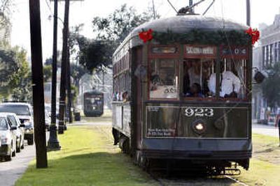 
Streetcars run along the Uptown section of the St. Charles Avenue line in New Orleans Saturday for the first time since Hurricane Katrina. Associated Press
 (Associated Press / The Spokesman-Review)