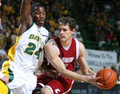 
Washington State's Nikola Koprivica looks to pass around Baylor's LaceDarius Dunn during the first half.Associated Press
 (Associated Press / The Spokesman-Review)