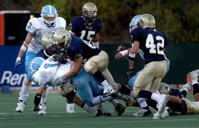 
Mead High School defenders have the team concept down as they show in burying this Central Valley player.
 (Jed Conklin / The Spokesman-Review)