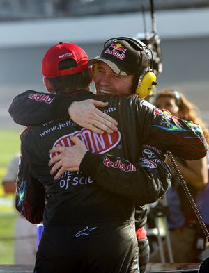 Race runner-up Jeff Gordon, driver of the No. 24 Dupont Chevrolet, congratulates Brian Vickers (right), driver of the No. 83 Red Bull Toyota, after the 25-year-old won Sunday's NASCAR Sprint Cup Series CARFAX 400 at Michigan International Speedway in Brooklyn, Mich. (Photo Credit: Jerry Markland/Getty Images for NASCAR)  (Jerry Markland / The Spokesman-Review)