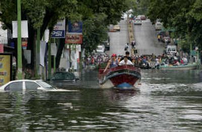 
People evacuate a flooded area Saturday in Villahermosa, Mexico. Associated Press
 (Associated Press / The Spokesman-Review)