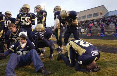 
The Timberlake defense is shocked as they react to an intercepted pass in overtime that gave McCall-Donnelly a 35-28 win. 
 (Brian Plonka / The Spokesman-Review)