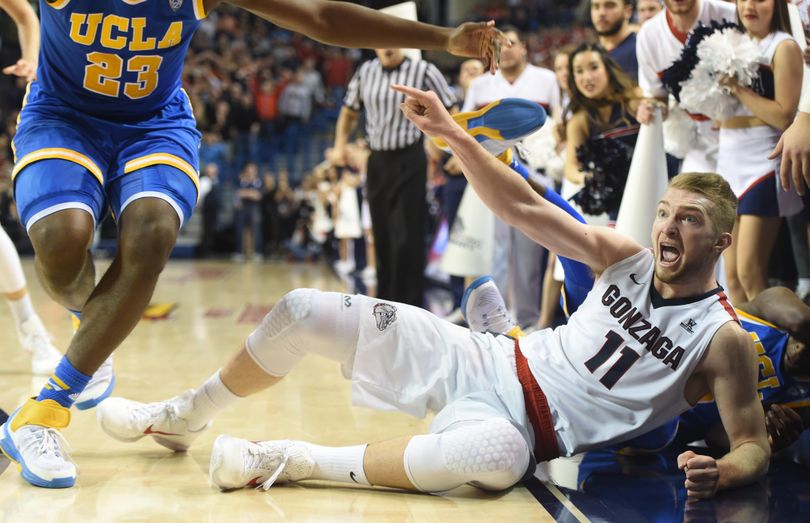 Gonzaga’s Domantas Sabonis points at UCLA’s Tony Parker, left, after chasing a loose ball to the sidelines in the second half Saturday, Dec. 12, 2015 at McCarthey Athletic Center. The call went Sabonis’ way, but the UCLA Bruins edged the Zags 71-66. (Jesse Tinsley / The Spokesman-Review)