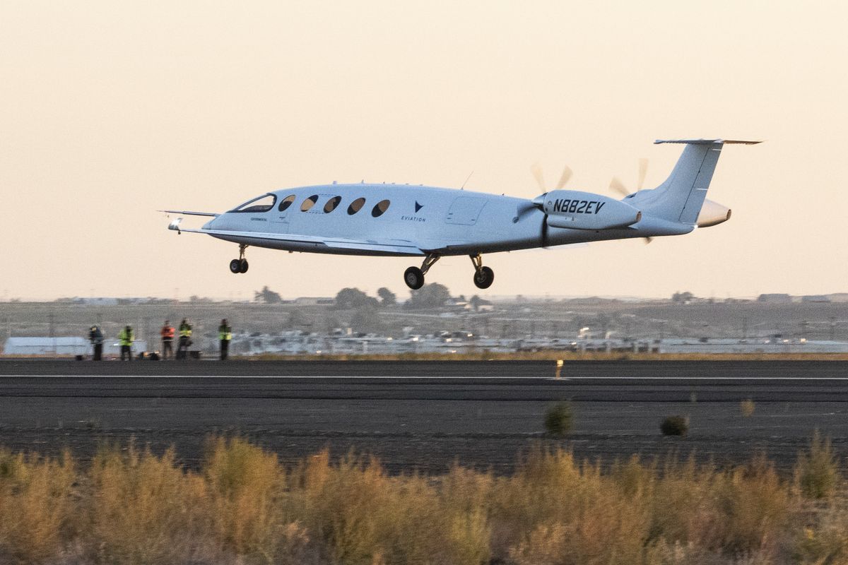 The all-electric airplane called Alice, designed and built in Arlington, Wash., takes off on its first flight in Moses Lake on Tuesday.  (Ellen M. Banner)