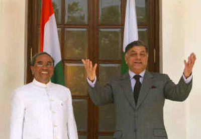 
Indian Foreign Secretary Shashank, left, and Pakistani Foreign Secretary Riyaz Khokar pose for the media in the backdrop of their countries flags before their meeting in New Delhi, India, Sunday. Khokar arrived in India on Saturday for talks to ease tensions over Kashmir and other disputes between the nuclear-armed neighbors, who are currently involved in a sweeping peace effort. 
 (Associated Press / The Spokesman-Review)
