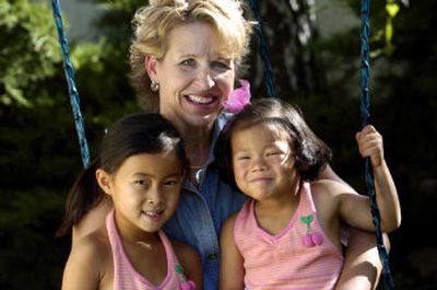 
Carol Waldenberg of Spokane adopted her daughters Sophia, 6, and Olivia, 3, from China. Sept. 15 has been declared International Gotcha Day, a day to celebrate adoptions. 
 (Holly Pickett / The Spokesman-Review)
