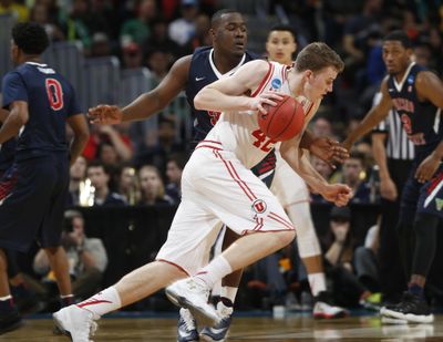 Utah forward Jakob Poeltl, front, drives past Fresno State center Terrell Carter II in the second half of a first-round men’s college basketball game Thursday, March 17, 2016, in the NCAA Tournament in Denver. Utah won 80-69. (David Zalubowski / Associated Press)