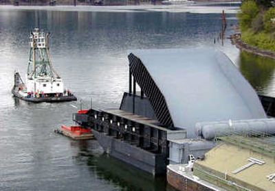 
This photo released by the U.S. Corps of Engineers shows a removable spillway weir being barged to the Lower Granite Dam on the Snake River in Idaho in 2003.
 (File/Associated Press / The Spokesman-Review)