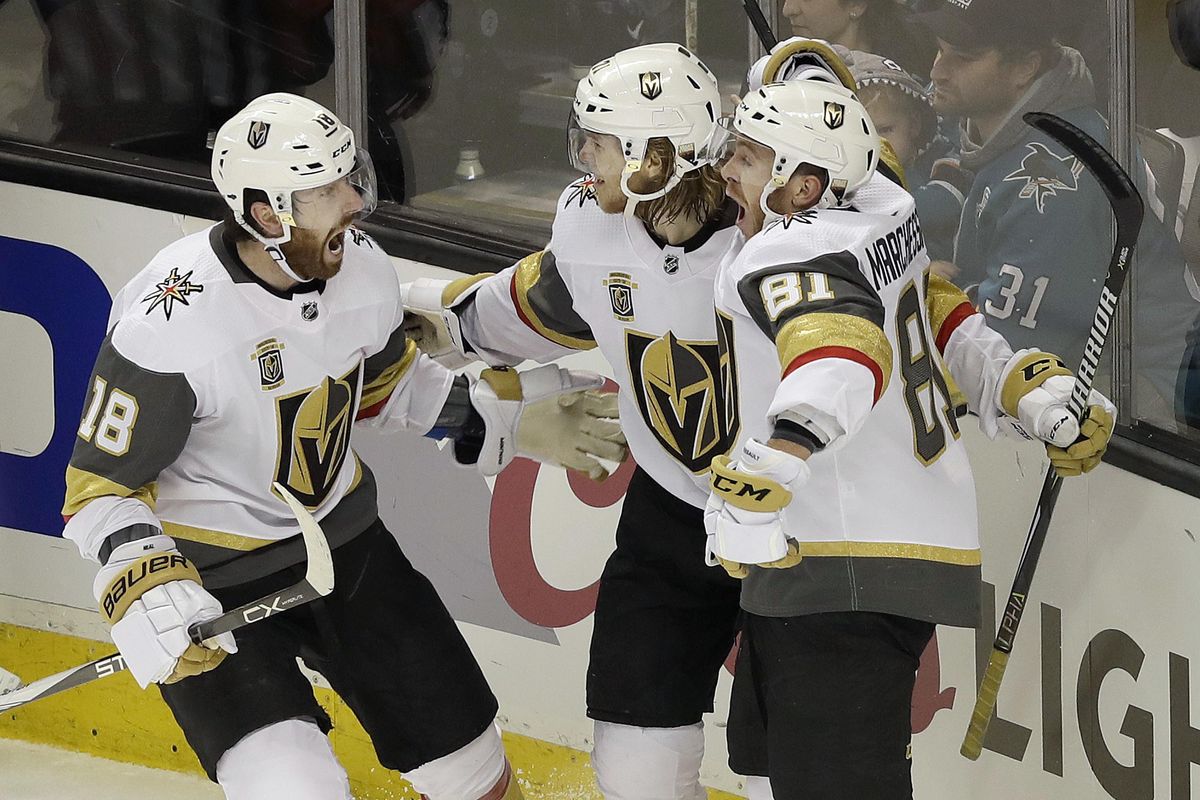 Vegas Golden Knights center William Karlsson, center, from Sweden, celebrates with left wing James Neal (18) and center Jonathan Marchessault (81) after scoring the winning goal against the San Jose Sharks during overtime of Game 3 of an NHL hockey second-round playoff series in San Jose, Calif., Monday, April 30, 2018. The Golden Knights won 4-3. (Jeff Chiu / Associated Press)