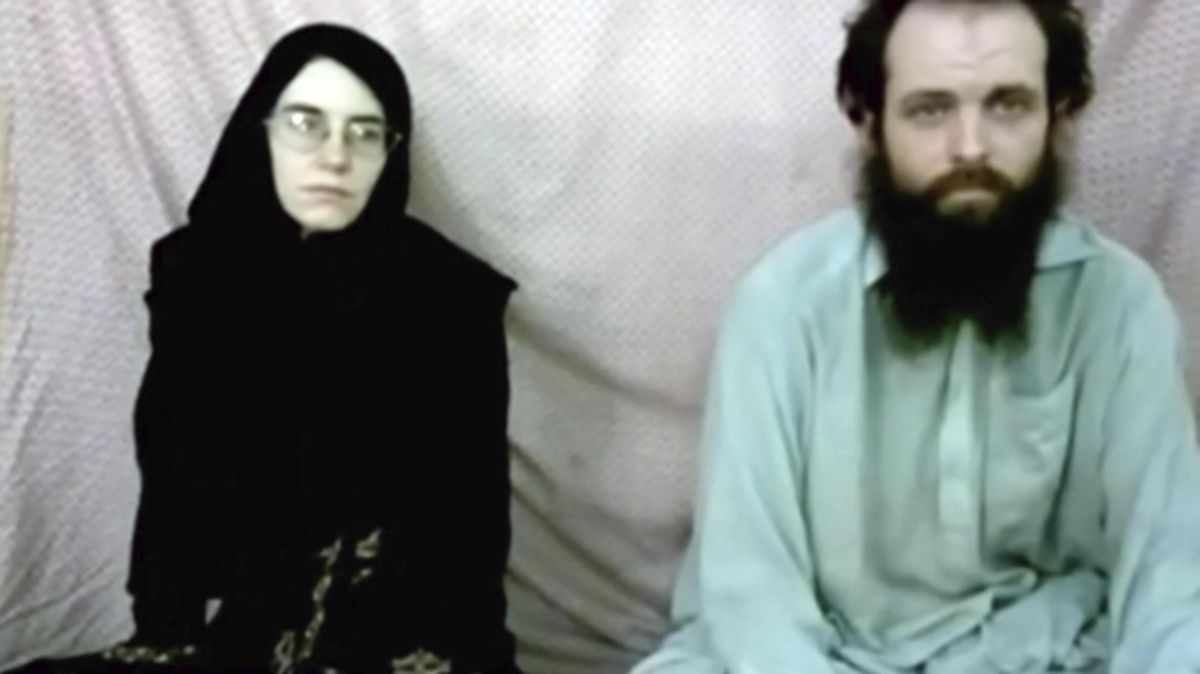 This still image made from a 2013 video released by the Coleman family shows Caitlan Coleman and her husband, Canadian Joshua Boyle in a militant video given to the family. The American woman, her Canadian husband and their three young children have been released in October 2017 after years of being held captive by a network with ties to the Taliban. The two were abducted five years ago while traveling in Afghanistan and have been held by the Haqqani network. The couple had three children while in captivity. (AP)